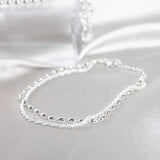Elegant set of silver bracelets with zirconia stones
