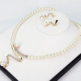Set of a necklace and earrings with natural pearls