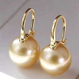 Elegant gold earrings with pearls
